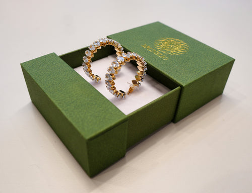 Golden earrings with white diamonds