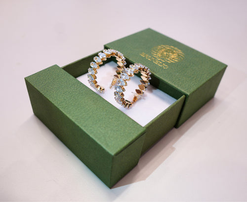 Golden earrings with white diamonds