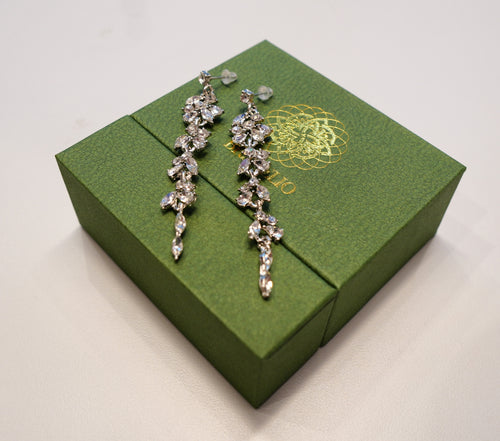 Long silver earring with diamonds