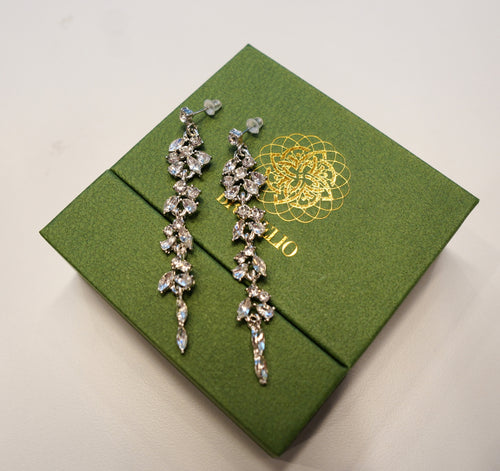 Long silver earring with diamonds