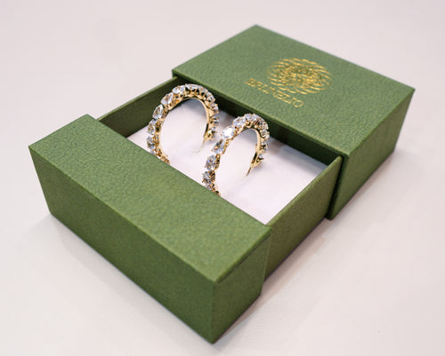 Round gold earrings with silver and white diamonds