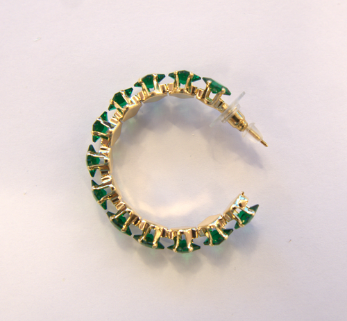 Golden earrings with green crystals